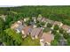 An aerial view of neighborhood homes surrounded by lush, mature trees at 1280 Winged Foot Dr, Denver, NC 28037