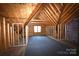 Unfinished attic with exposed wood framing at 1280 Winged Foot Dr, Denver, NC 28037
