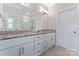 Bathroom featuring double sinks, granite countertops, white cabinets, and a large mirror at 1280 Winged Foot Dr, Denver, NC 28037