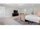A large bedroom provides room for furniture, carpeted floors, and natural light to create a peaceful ambiance at 1280 Winged Foot Dr, Denver, NC 28037