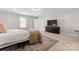 Bright bedroom features a large window, closet, black dresser and television at 1280 Winged Foot Dr, Denver, NC 28037