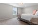 Bedroom features a neutral color palette, window and wood floors at 1280 Winged Foot Dr, Denver, NC 28037