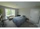 Cozy bedroom features a bed, window with natural light, and neutral decor at 1280 Winged Foot Dr, Denver, NC 28037