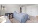 This bedroom has a natural colored carpet with gray walls, and two closets, for a comfortable experience at 1280 Winged Foot Dr, Denver, NC 28037