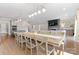 Bright dining area featuring a long table, pendant lighting, and an open layout to the living room at 1280 Winged Foot Dr, Denver, NC 28037