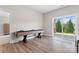 Spacious game room features a shuffleboard table and sliding glass doors at 1280 Winged Foot Dr, Denver, NC 28037