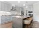 Stylish kitchen with granite countertops, stainless steel appliances, and bar seating for a modern, functional space at 1280 Winged Foot Dr, Denver, NC 28037