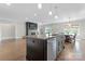 Spacious kitchen with an island, stainless steel appliances, and hardwood floors with views of a dining area at 1280 Winged Foot Dr, Denver, NC 28037
