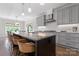 Modern kitchen with a large island, bar seating, and stainless steel appliances, perfect for entertaining guests at 1280 Winged Foot Dr, Denver, NC 28037