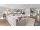 Spacious living room with a large sectional sofa, open to the kitchen, and stairs to the second floor at 1280 Winged Foot Dr, Denver, NC 28037