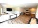 Open basement rec room with TV, seating, pool table and modern flooring at 1280 Winged Foot Dr, Denver, NC 28037