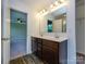 Bathroom featuring a double sink vanity with modern fixtures at 13022 Hill Pine Rd, Midland, NC 28107