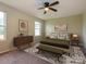 Well-decorated bedroom featuring a bed, modern dresser, lamps, and an area rug at 13022 Hill Pine Rd, Midland, NC 28107