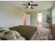 Cozy bedroom with neutral tones, accented by a vibrant plant and modern furniture at 13022 Hill Pine Rd, Midland, NC 28107