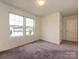 Bright bedroom with two large windows offering ample natural light at 13022 Hill Pine Rd, Midland, NC 28107