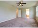 Bedroom with a ceiling fan and multiple doorways, offering potential layout options at 13022 Hill Pine Rd, Midland, NC 28107