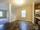 Dining area with laminate flooring, ample lighting, and view to the living room and kitchen, perfect for entertaining at 13022 Hill Pine Rd, Midland, NC 28107