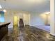 Spacious open-concept living area with wood floors, neutral walls, and a staircase at 13022 Hill Pine Rd, Midland, NC 28107