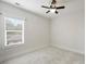 Bedroom featuring a ceiling fan, neutral walls, and natural light at 1315 Charles Ave, Charlotte, NC 28205