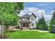 Beautiful exterior showcasing the home, back porch, and expansive yard at 1315 Charles Ave, Charlotte, NC 28205