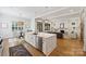 Bright, open kitchen featuring a large island, stainless steel appliances, and seamless flow to the living area at 1315 Charles Ave, Charlotte, NC 28205