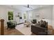 Cozy living room with hardwood floors, neutral decor, and ample natural light at 1315 Charles Ave, Charlotte, NC 28205