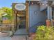 Exterior view of The Goodyear House featuring a wooden entry and outdoor seating at 1315 Charles Ave, Charlotte, NC 28205