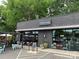 The Artisan's Palate, a brick building with a patio area and outdoor seating at 1315 Charles Ave, Charlotte, NC 28205