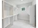 Spacious walk-in closet with custom shelving and natural light at 1315 Charles Ave, Charlotte, NC 28205