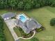 The home's exterior with swimming pool, large lot and landscaping at 1340 Canter Ln, York, SC 29745