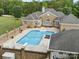 The in-ground pool and outdoor living space are surrounded by a privacy wall at 1340 Canter Ln, York, SC 29745