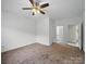 Bedroom with ceiling fan, neutral decor, and access to other rooms at 1340 Canter Ln, York, SC 29745