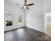 Bedroom featuring tile flooring, two windows, and a ceiling fan at 1340 Canter Ln, York, SC 29745
