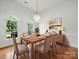 Elegant dining room with modern chandelier, stylish furnishings, and ample natural light at 1340 Canter Ln, York, SC 29745