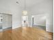 Open floorplan with hardwood floors, elegant lighting and easy access to multiple living spaces, great for entertaining at 1340 Canter Ln, York, SC 29745
