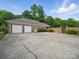 Wide driveway and a three car garage on a beautiful brick home at 1340 Canter Ln, York, SC 29745