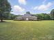 Charming brick home with a well-manicured lawn and landscaping providing a welcoming curb appeal at 1340 Canter Ln, York, SC 29745