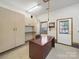 Garage office space with built-in cabinets, a desk, and a window to the outside at 1340 Canter Ln, York, SC 29745