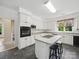 Bright kitchen with an island cooktop, white cabinetry, and modern appliances at 1340 Canter Ln, York, SC 29745