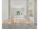 Bright living room with hardwood floors, fireplace, built-in shelves, and elegant columns at 1340 Canter Ln, York, SC 29745