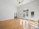Expansive living room with gleaming hardwood floors, high ceilings, and inviting backyard views at 1340 Canter Ln, York, SC 29745