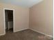 Another bedroom features a view to bathroom at 13441 Calloway Glen Dr, Charlotte, NC 28273