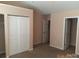This bedroom boasts spacious closets and neutral walls at 13441 Calloway Glen Dr, Charlotte, NC 28273