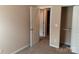 Clean bedroom featuring carpeted floors, closet, and a view to an ensuite bath at 13441 Calloway Glen Dr, Charlotte, NC 28273