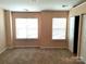Bright bedroom with two windows and ample closet space at 13441 Calloway Glen Dr, Charlotte, NC 28273