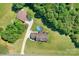Aerial shot displaying home and pool creating a private retreat surrounded by mature trees at 136 Barringer Dr, Statesville, NC 28625