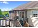 Cozy back porch with steps leading down to the pool area, perfect for relaxation at 136 Barringer Dr, Statesville, NC 28625