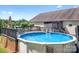 Enjoy the outdoors with this above-ground pool and spacious deck, ideal for entertaining at 136 Barringer Dr, Statesville, NC 28625