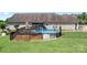 An above-ground pool with deck and privacy fencing add to the appeal of this backyard at 136 Barringer Dr, Statesville, NC 28625
