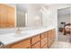 Bathroom features double sinks, wood cabinets, and a large mirror at 136 Barringer Dr, Statesville, NC 28625